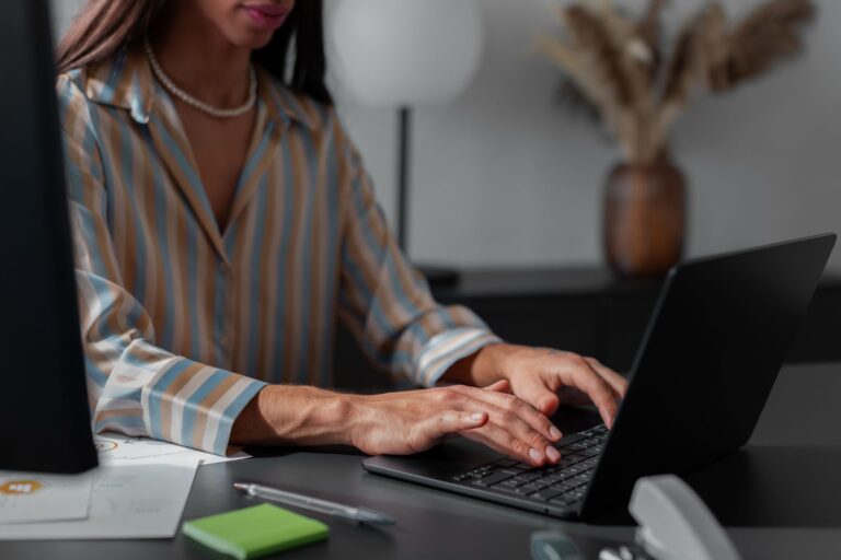 Side view of womanl working with laptop